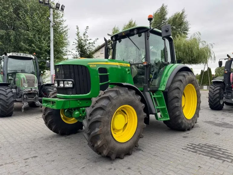 JOHN DEERE 6534 / Przednia oś amortyzowana TLS / PowrQuad Plus /